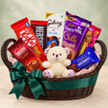 Emerald Embrace chocolate gift basket with 7 packs and ivory teddy