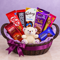 Royal Plum chocolate gift basket with 7 packs and ivory teddy