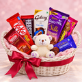 Ruby Romance chocolate gift basket with 7 packs and ivory teddy